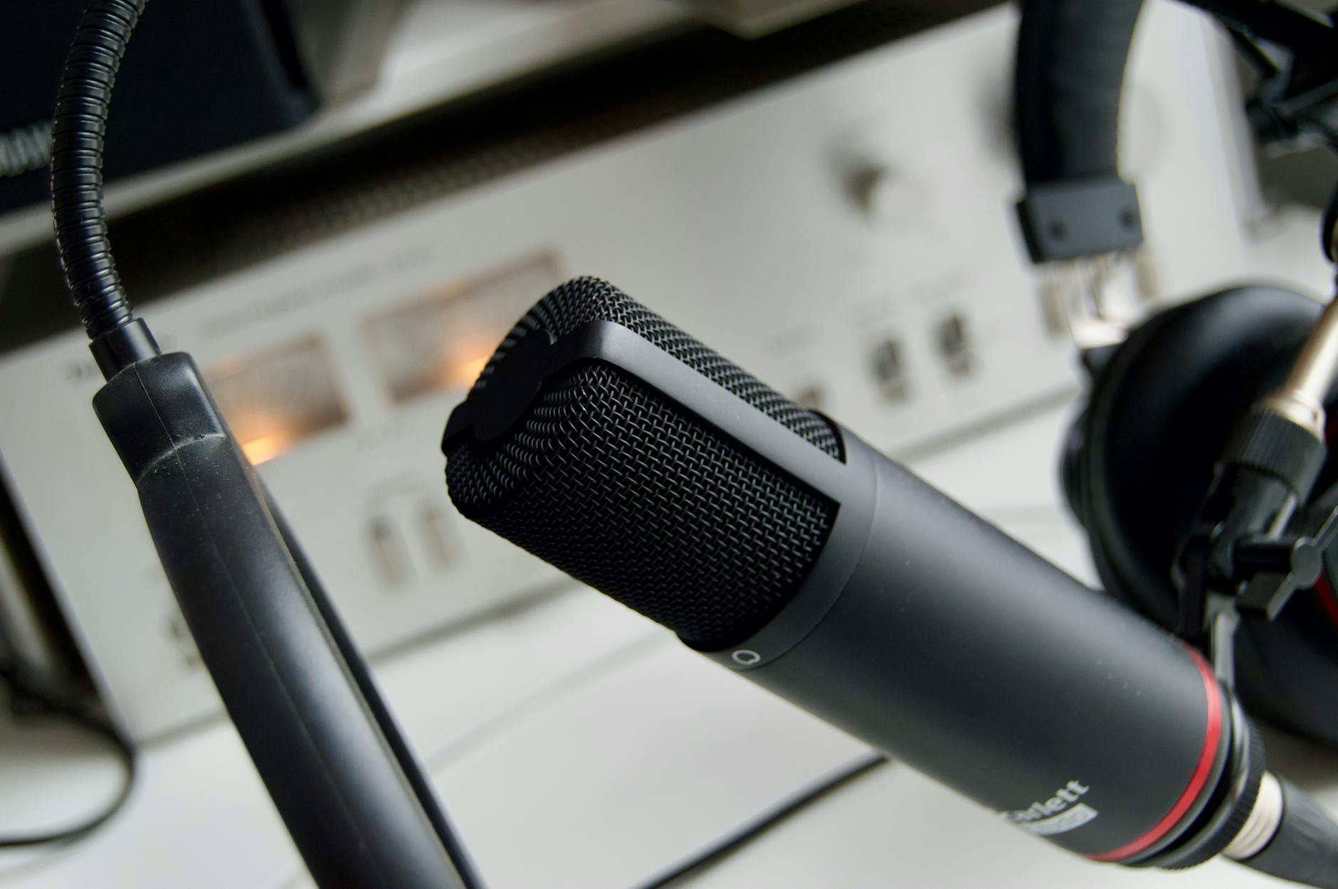 "Comparing Descript and Adobe Podcast editing software for creators and producers."
