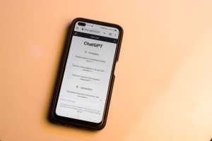 User holding a smartphone displaying the best chatgpt app interface for mobile AI assistance.