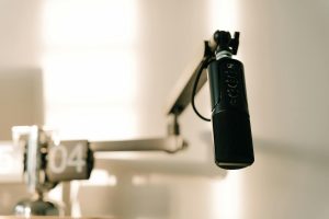 Comparison of Descript and Adobe Podcast features, pricing, and workflow in a side‑by‑side review.