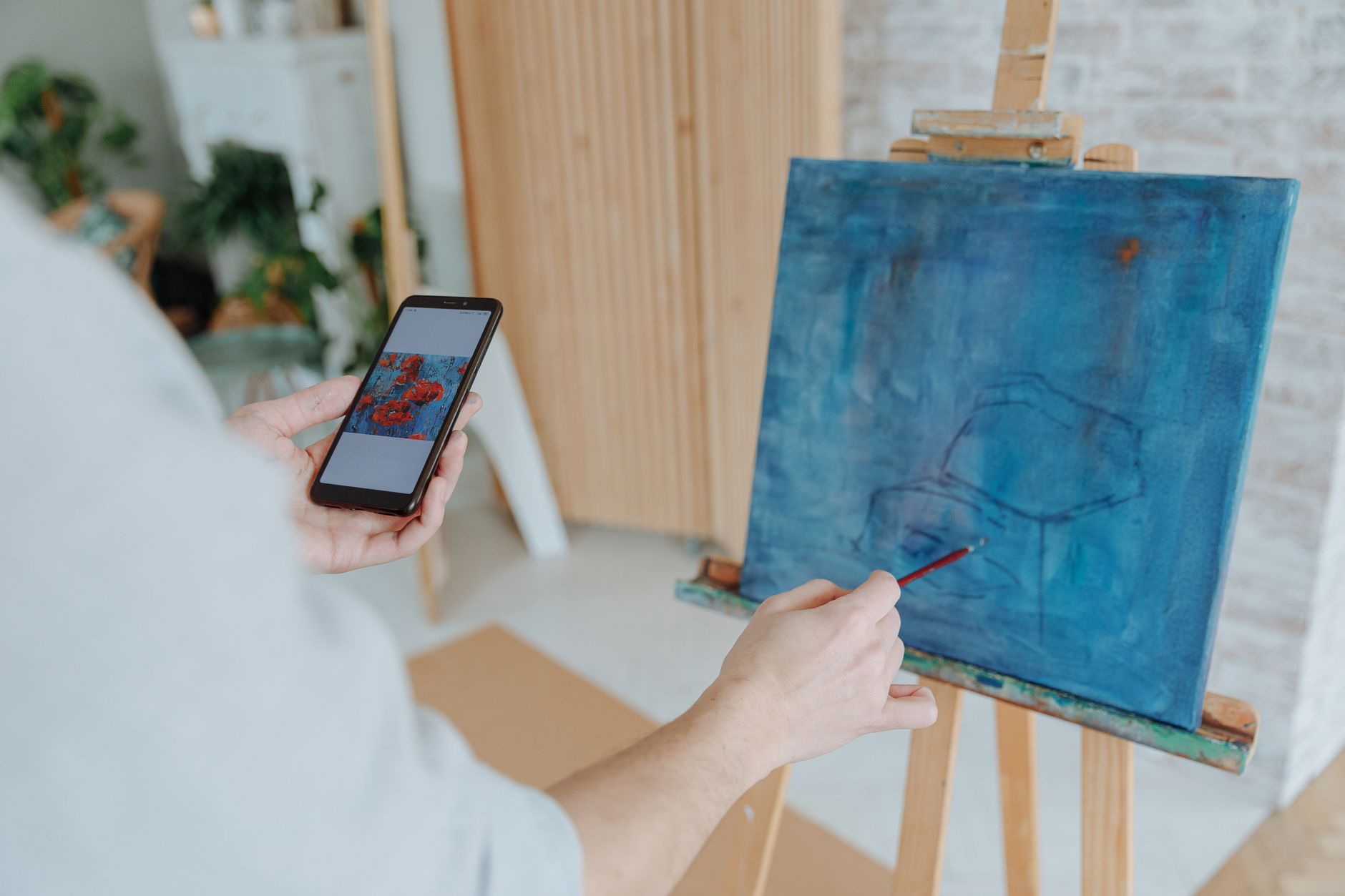 Step-by-step guide showing a laptop screen with an Etsy shop dashboard and AI‑generated art thumbnails ready for sale