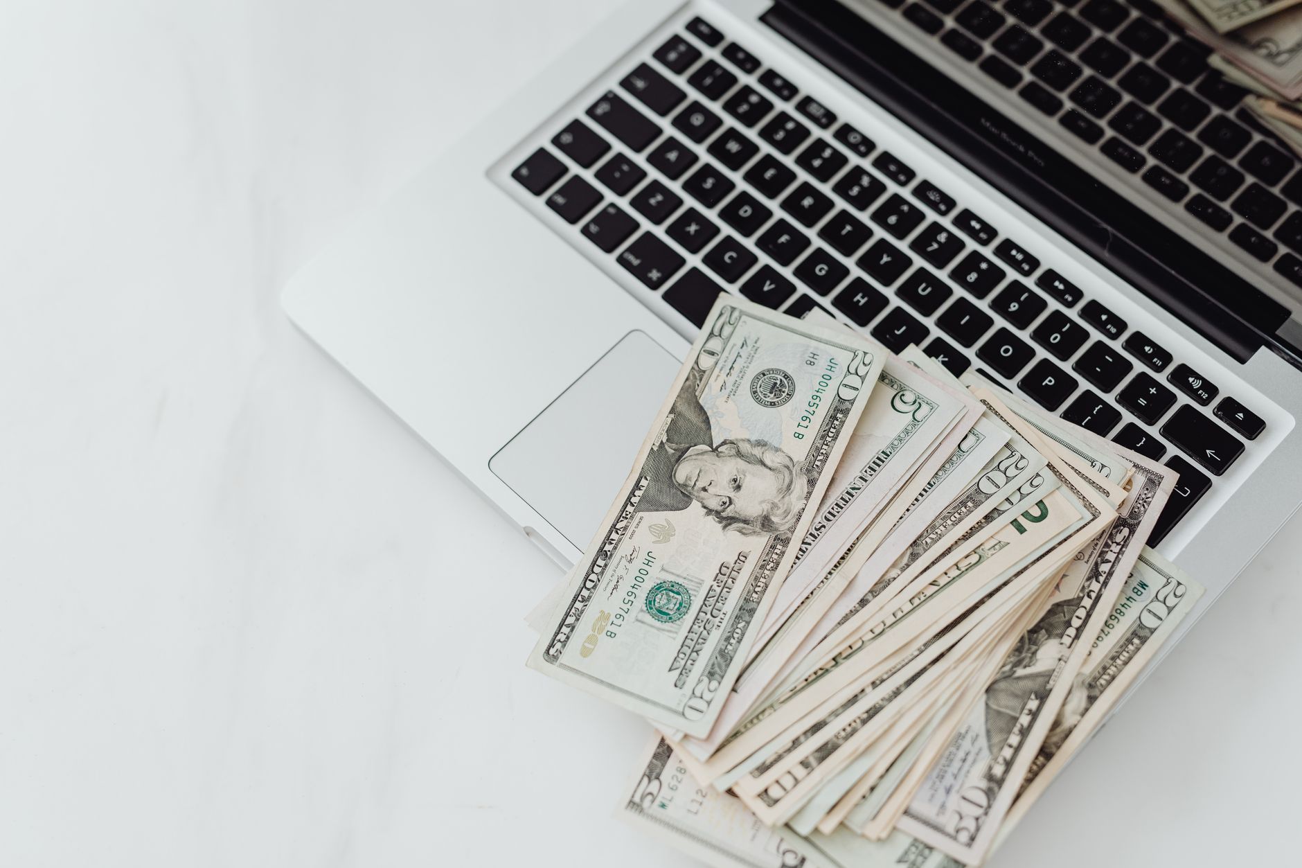 A laptop displaying a chart of rapid online earnings, symbolizing fast wealth‑building strategies
