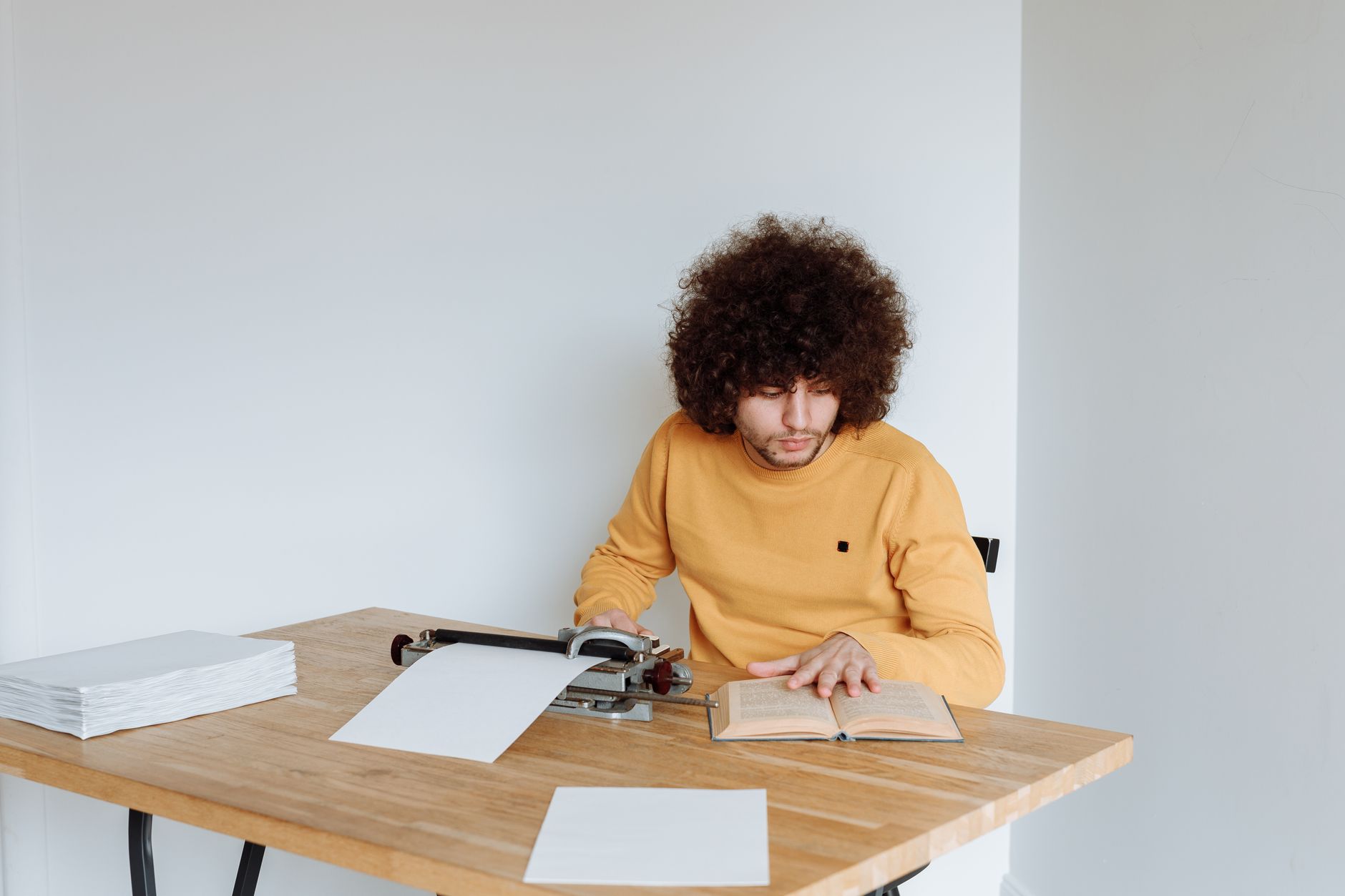 A professional writer using an AI text generator tool on a laptop to draft articles.